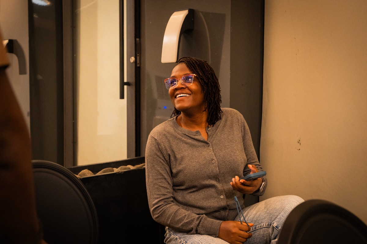 A member of the community listening during a gathering